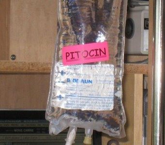 IV bag labeled Pitocin (synthetic oxytocin)