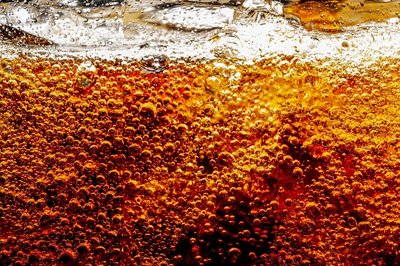 Opening a carbonated beverage