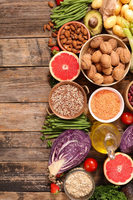 Assorted nutrient-dense foods including fruits, vegetables, nuts, and grains