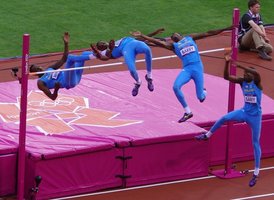 Athlete performing high jump, illustrating muscle movement