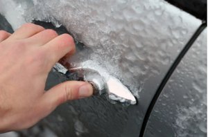 Hand touching frozen car handle (thermoreception)