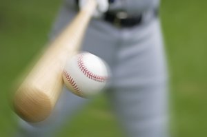 Baseball player hitting a ball