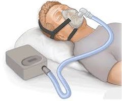 Person using CPAP machine for sleep apnea
