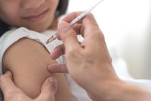 A person receiving a vaccine injection
