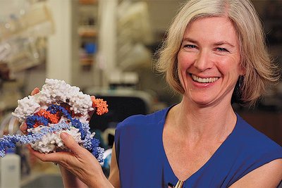 Scientist holding a model of CRISPR-Cas9, symbolizing ethical considerations in gene editing