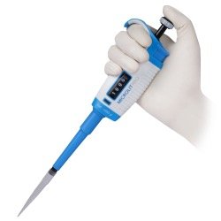 Gloved hand holding a micropipette