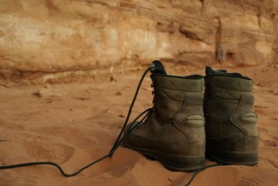 Hiking boots in a natural environment, symbolizing human interaction with nature