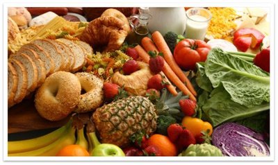 Assorted foods rich in carbohydrates, including bread, fruits, and vegetables