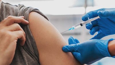 Person receiving a vaccine injection