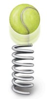 Tennis ball released from spring representing conversion to kinetic energy