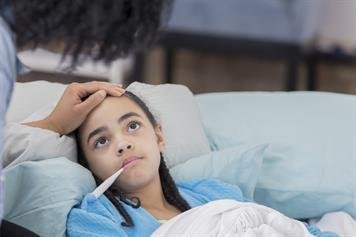 Person with fever in bed