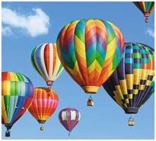 Hot air balloons rising due to heated air expanding inside the balloon