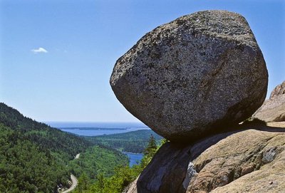Large boulder on a hill representing gravitational potential energy