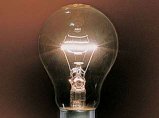 Light bulb filament glowing due to blackbody radiation