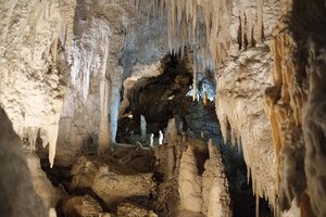 Formation of stalactites and stalagmites in a cave.