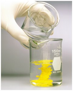 Precipitation reaction: formation of a yellow precipitate in a beaker