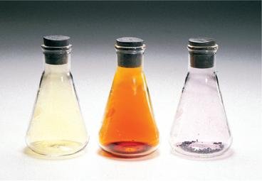 Three flasks containing colored gases