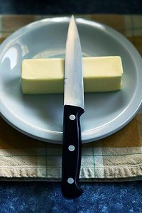 Butter, representing a colloid (solid emulsion)