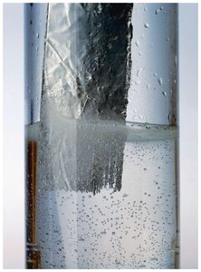 Aluminum dissolving in hydrochloric acid, producing bubbles