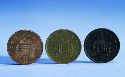 Copper coins showing gradual oxidation