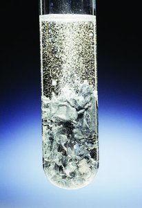 Zinc reacting with hydrochloric acid, producing hydrogen gas
