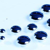 Liquid mercury droplets, representing mercury in its standard state