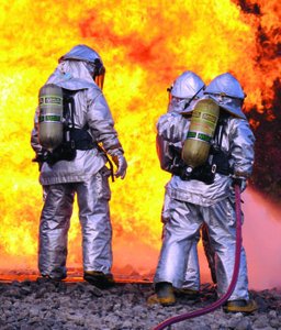 Firefighters in heat-resistant suits