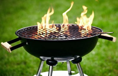 Barbecue grill with flames, representing energy transfer as heat