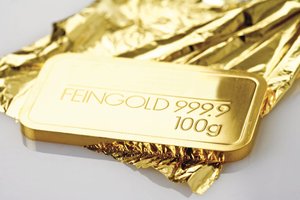 Gold ingot hammered to gold leaf
