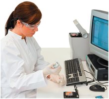 Clinical laboratory technician preparing specimen