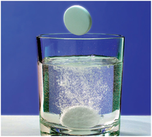 Antacid tablet reacting in water