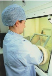 Person working with radioisotopes in a nuclear pharmacy