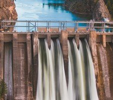 Water flowing over a dam as an example of kinetic energy