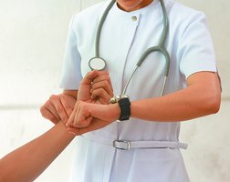 Nurse measuring time with a stopwatch