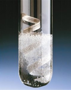 Reaction of a metal with acid producing hydrogen gas