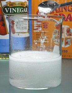Reaction of acid with bicarbonate producing carbon dioxide