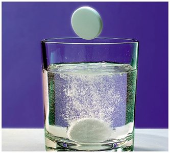 Antacid tablet reacting in water