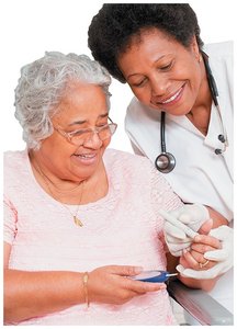 Diabetes nurse helping patient monitor blood sugar