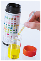 A dipstick being used to measure the specific gravity of urine