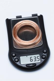 Copper wire on scale showing mass