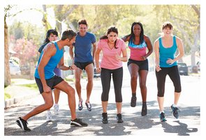 People exercising to reduce body fat