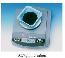 A scale with 8.25 grams of carbon