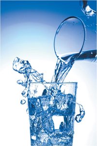 Pouring water into a glass