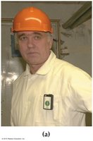 Worker wearing film-badge dosimeter