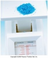 Powder on a digital balance, measuring mass