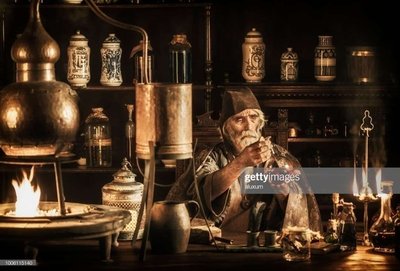 Alchemist working with laboratory apparatus