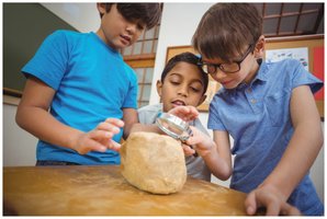 Children observing and investigating, representing curiosity in science