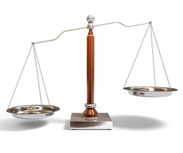 Balance scale representing nuclear stability