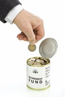 Hand placing coin in retirement fund can
