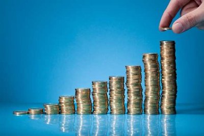 Stacked coins representing economic growth and doubling of wealth